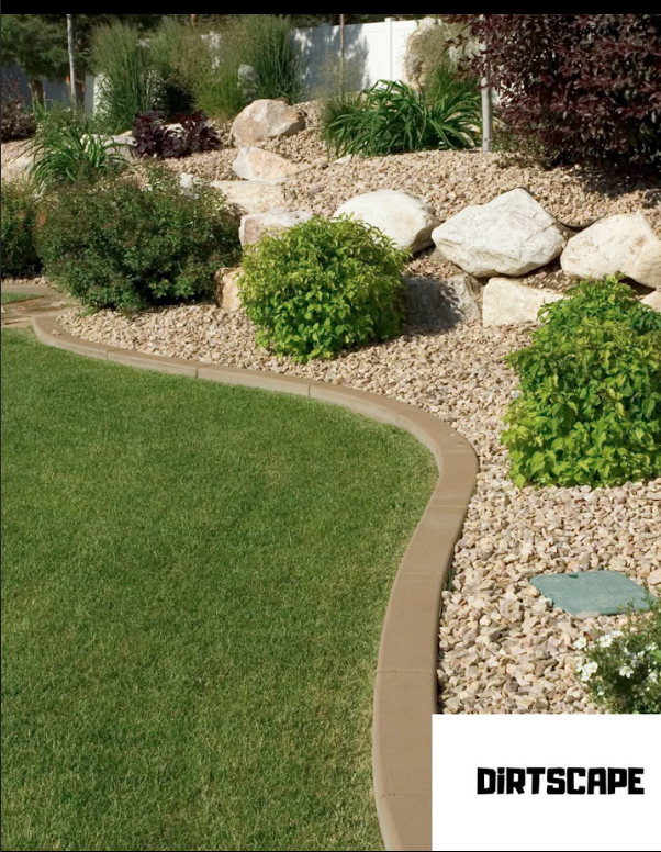 Decorative rock border landscaping with strategic plant placement in McDonough, GA