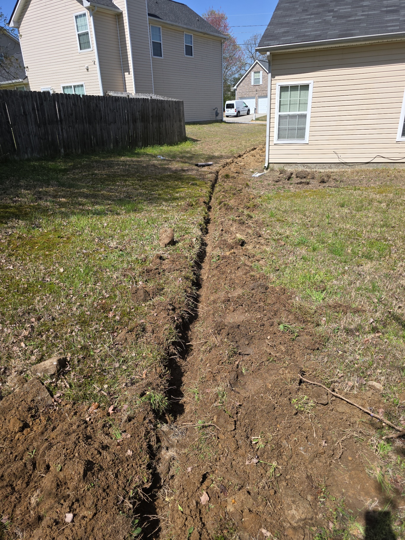 Residential drainage trench installation for water management in Peachtree City, GA