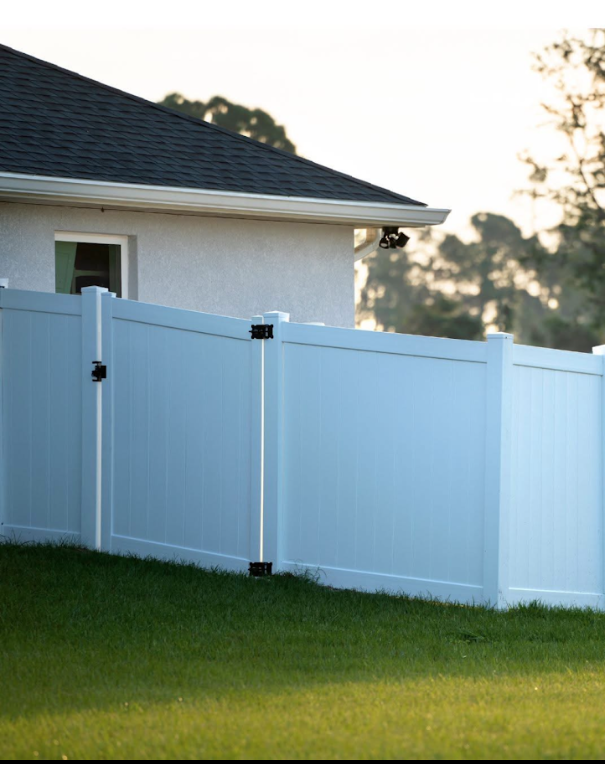 Modern white fence installation as part of hardscaping project in Lithonia, GA