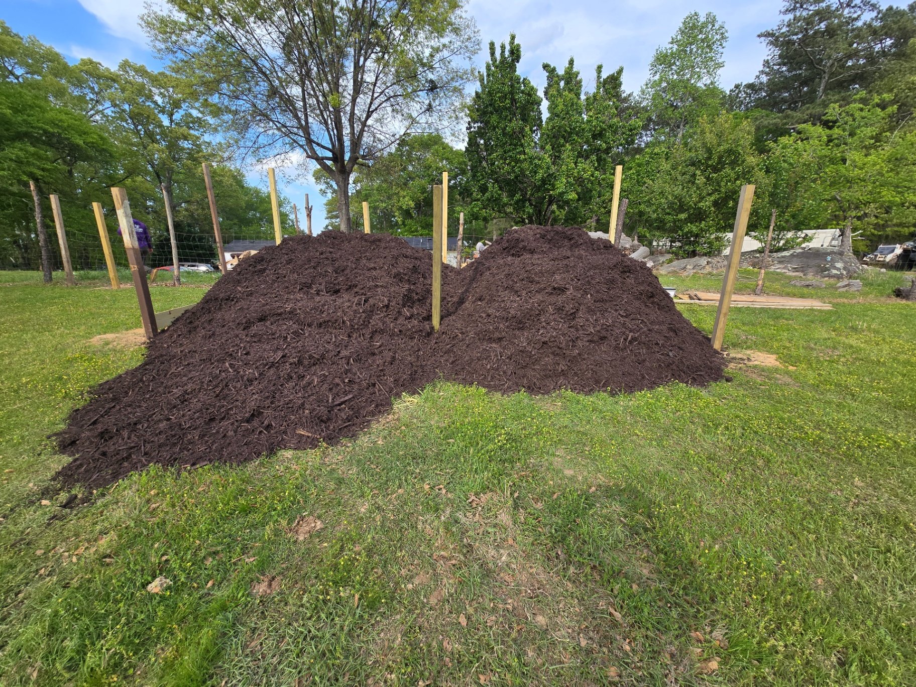 Large-scale mulch installation project with material preparation in Duluth, GA